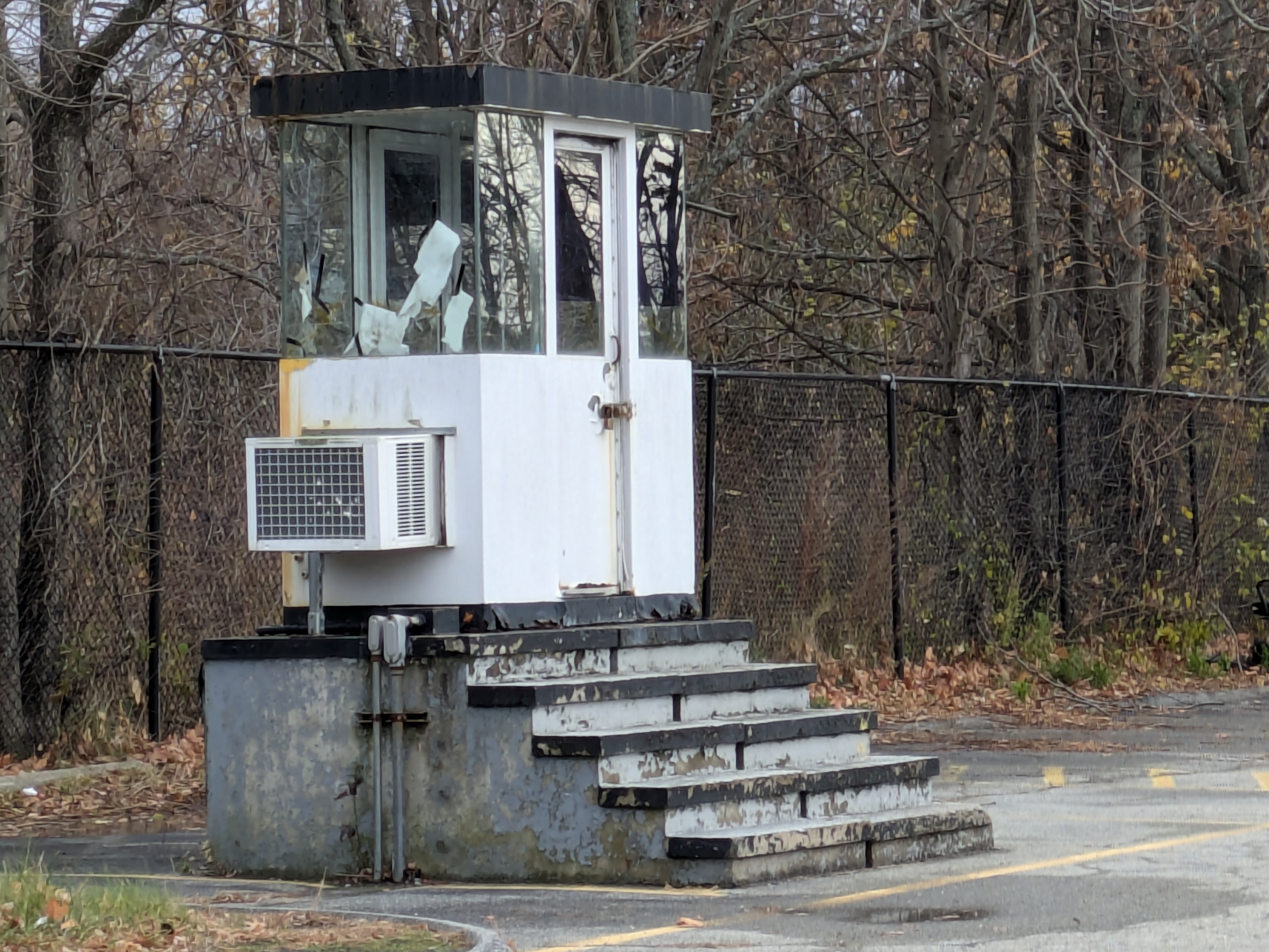 A small booth in a parking lot.